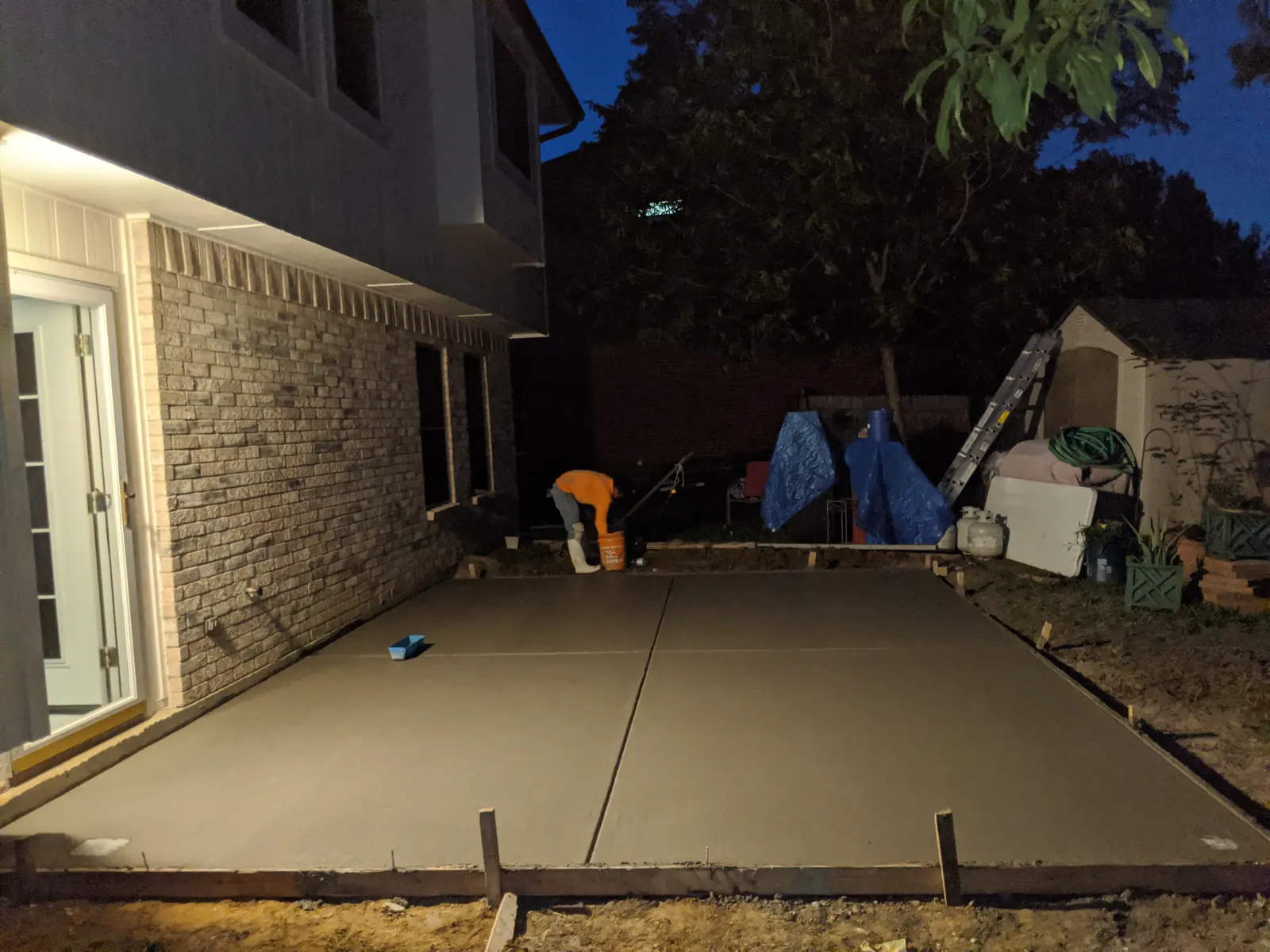 Patio slab finished after dark with control joints cut