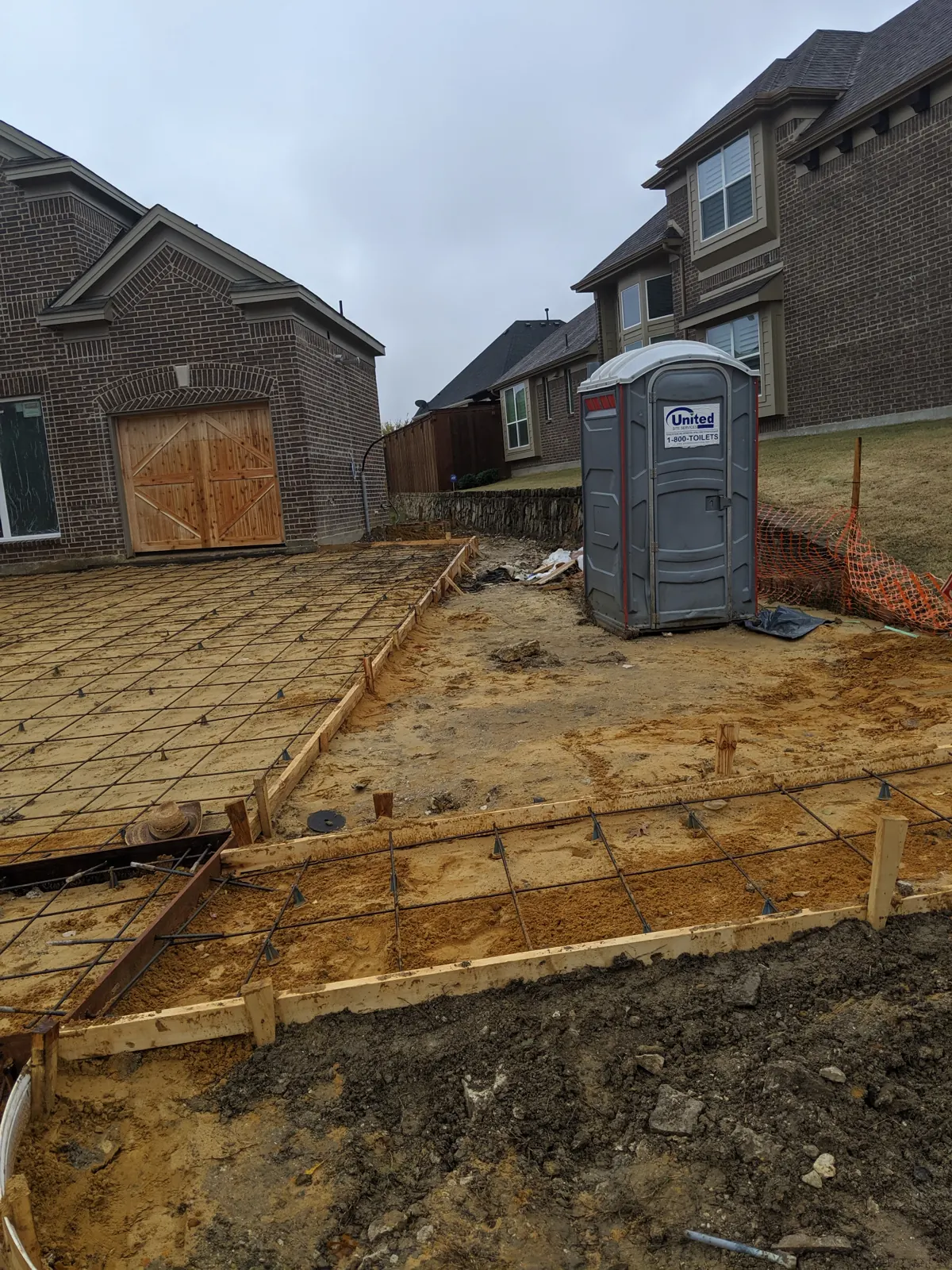 Rebar laid out on chairs for a driveway and side pad
