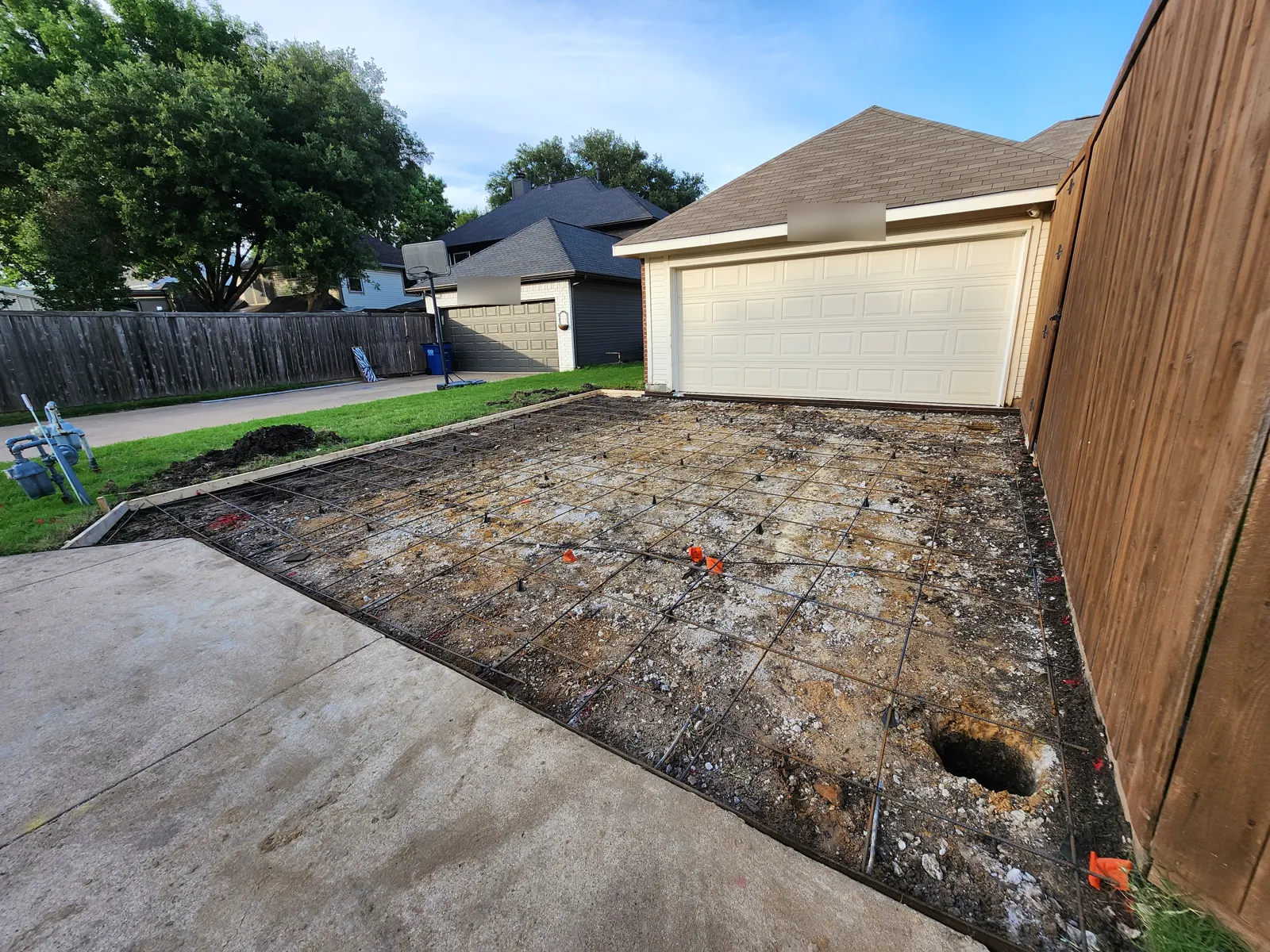 Rebar grid set on chairs inside forms for a new driveway