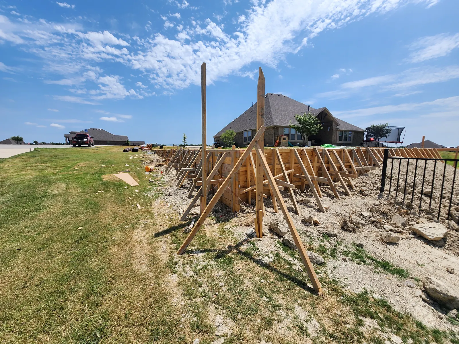 Braced wall forms running along a property line