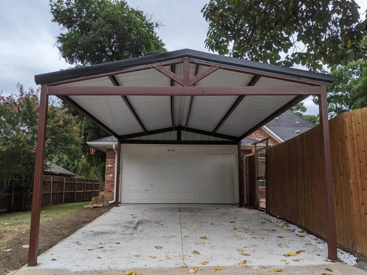 Steel-frame gable carport over a driveway