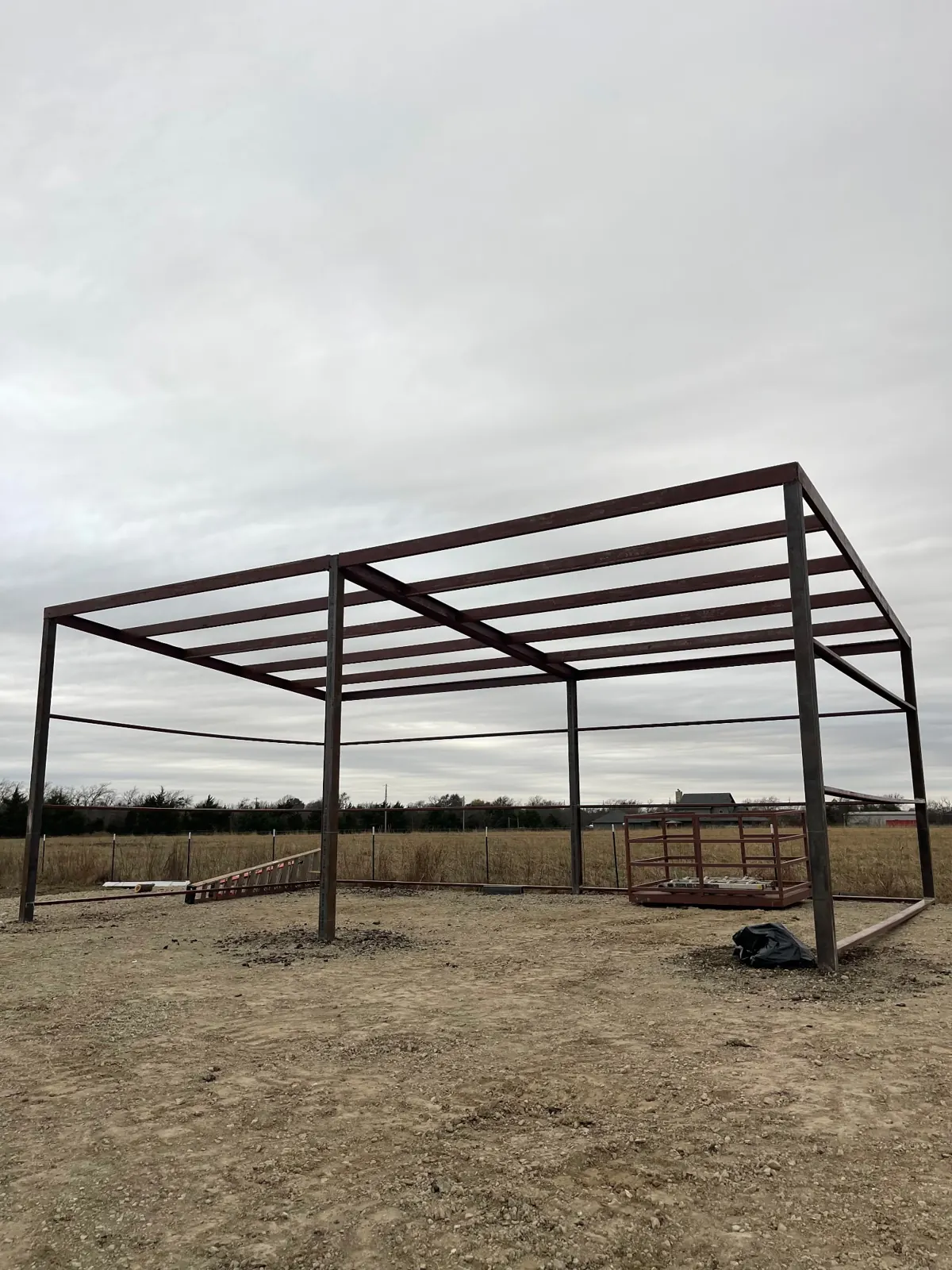 Steel frame of a metal shop going up on a graded pad